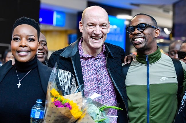 Nomcebo Zikode, Wouter Kellerman and Zakes Bantwini arrive at the airpirt after winning a Grammy for Bayethe. 